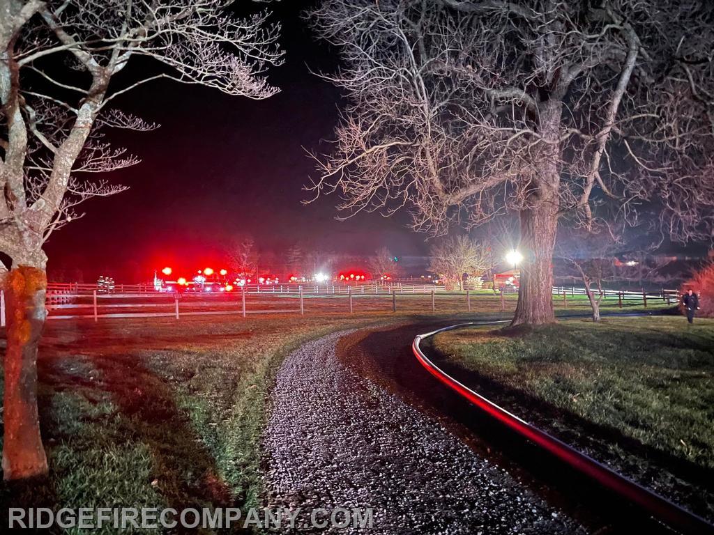 5in Supply Line heading down the driveway to Engine 62-5. View from Fire Scene out to the Tanker Operations on Rt. 23.